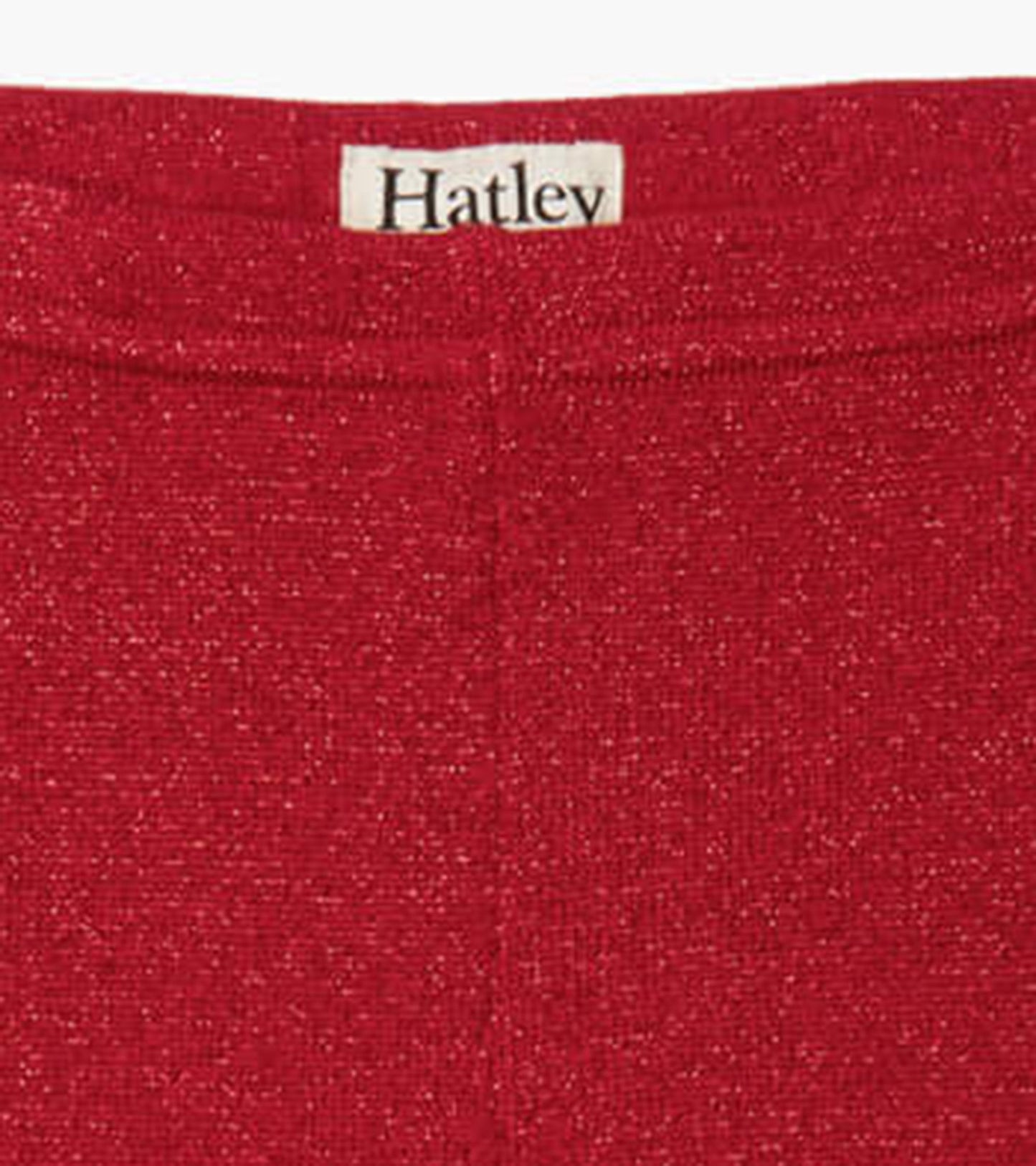 Red shimmer knit leggings with a soft texture, featuring an elastic waistband for comfort.