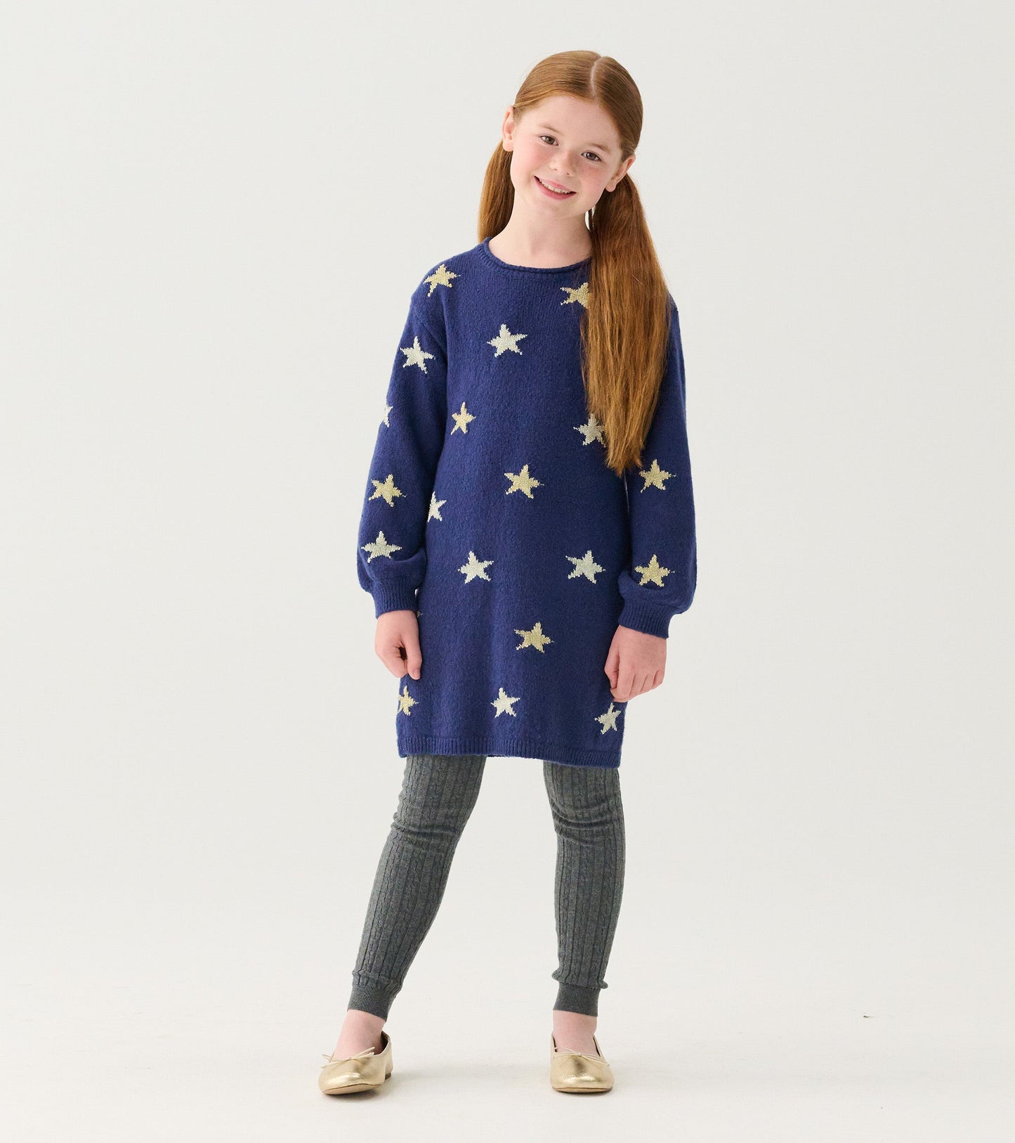 Charcoal cable knit tights with a textured pattern, suitable for girls, paired with a star-patterned dress.