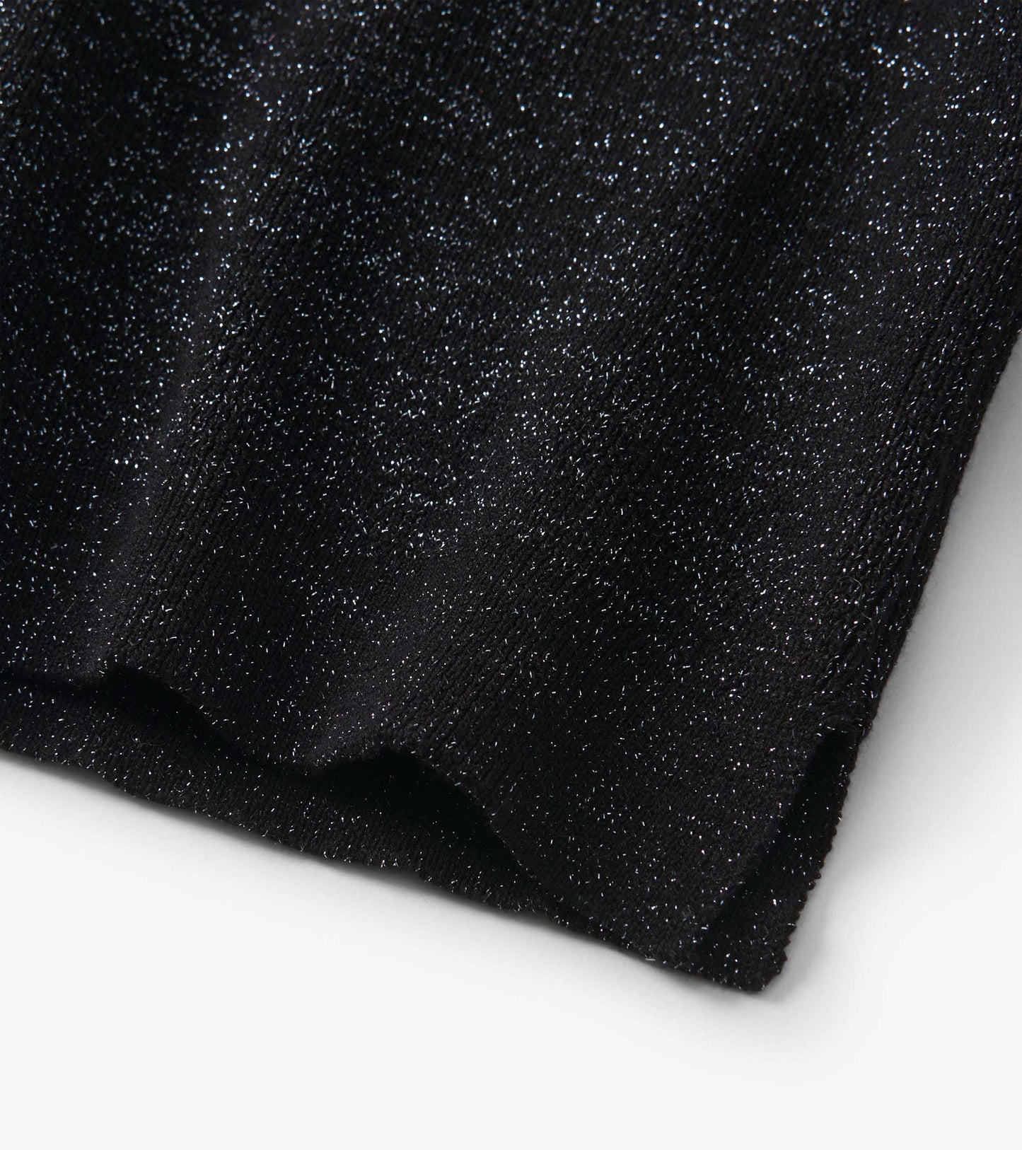 Black glitter knit turtleneck sweater fabric close-up with ribbed hem