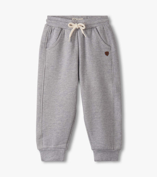 Grey athletic track pants for baby and toddler boys, featuring an elastic waistband and side pockets.