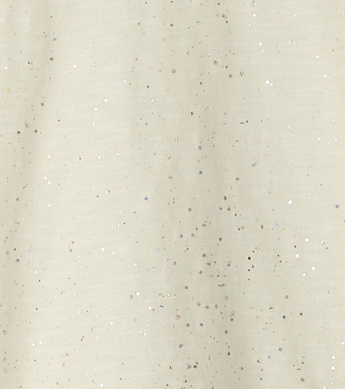 Light beige long sleeve graphic tee with silver glitter speckles throughout.