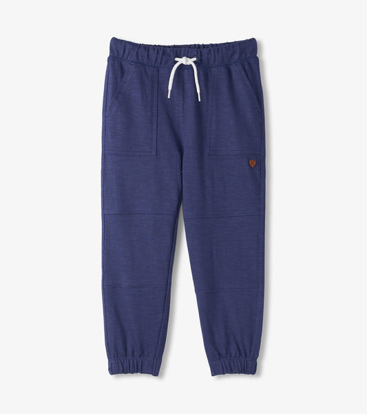 Navy cozy pants with an elastic waistband, drawstring, and side pockets, designed for boys.