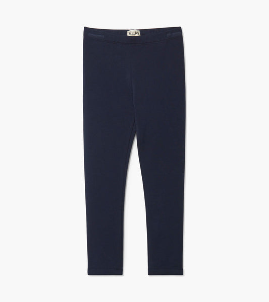 Navy blue cozy leggings made from soft material, featuring a simple design and elastic waistband.