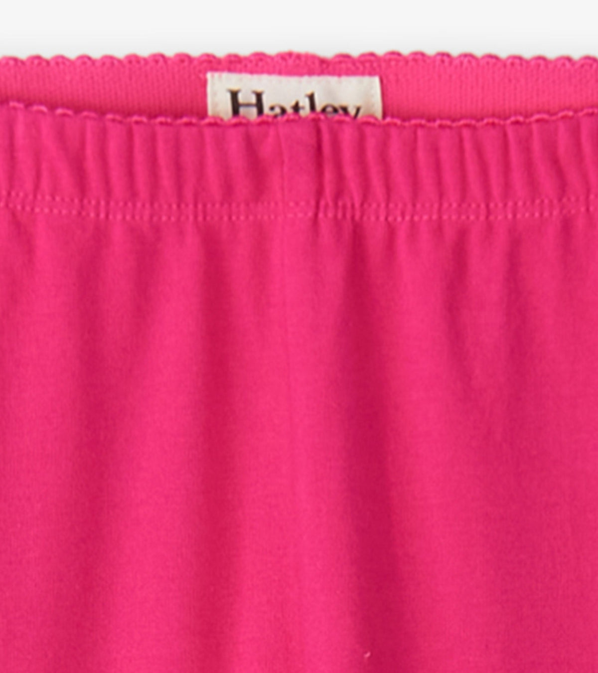 Bright pink leggings with an elastic waistband, suitable for casual wear.