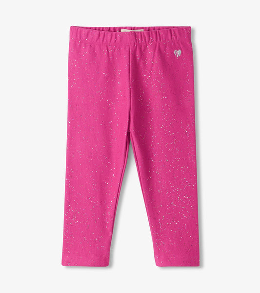 Bright pink cozy leggings with a sparkly pattern, featuring an elastic waistband for comfort.