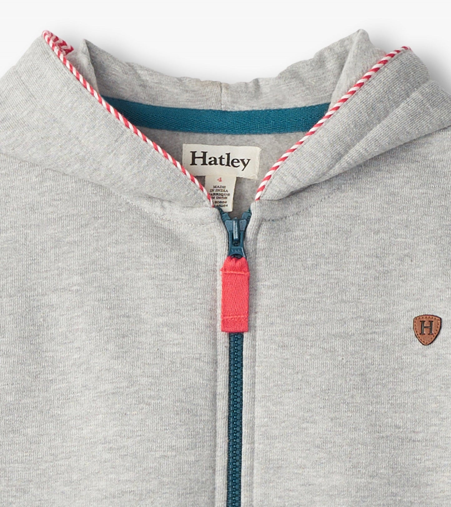 Grey zip-up hoodie with a red zipper pull and contrasting blue inner lining, featuring a small emblem on the chest.