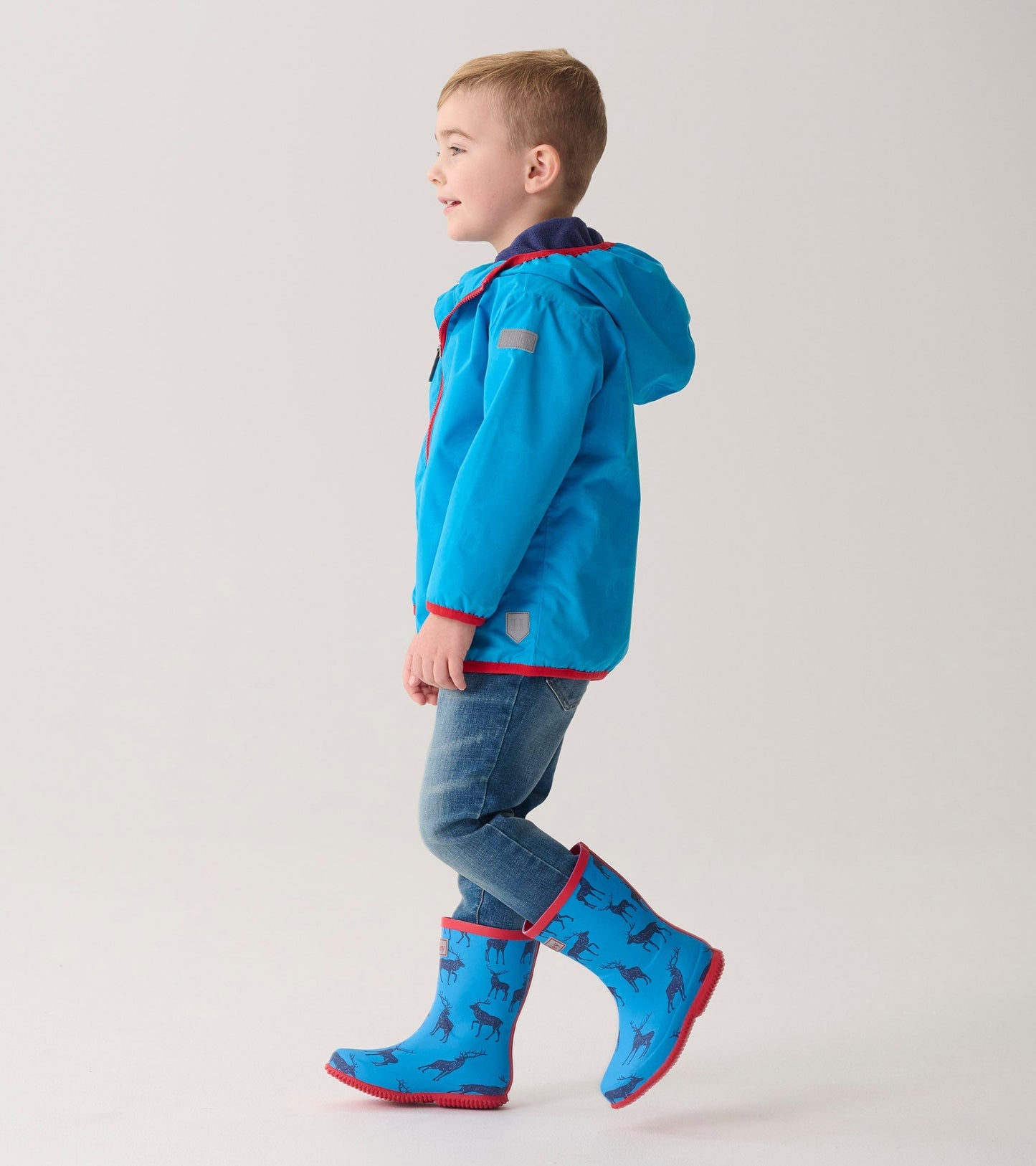 Bright blue packable wellies featuring a playful elk pattern, perfect for kids' outdoor adventures.
