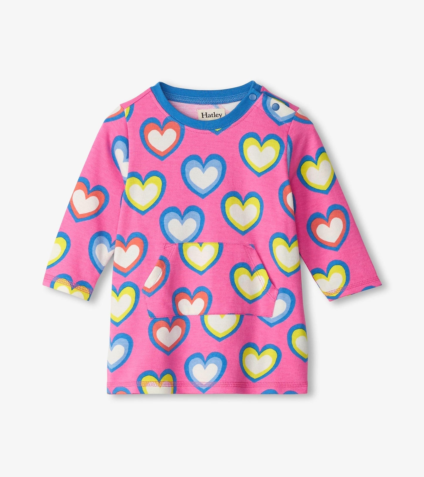 Pink terry dress featuring a colorful heart pattern, long sleeves, and a front pocket. Suitable for baby and toddler girls.