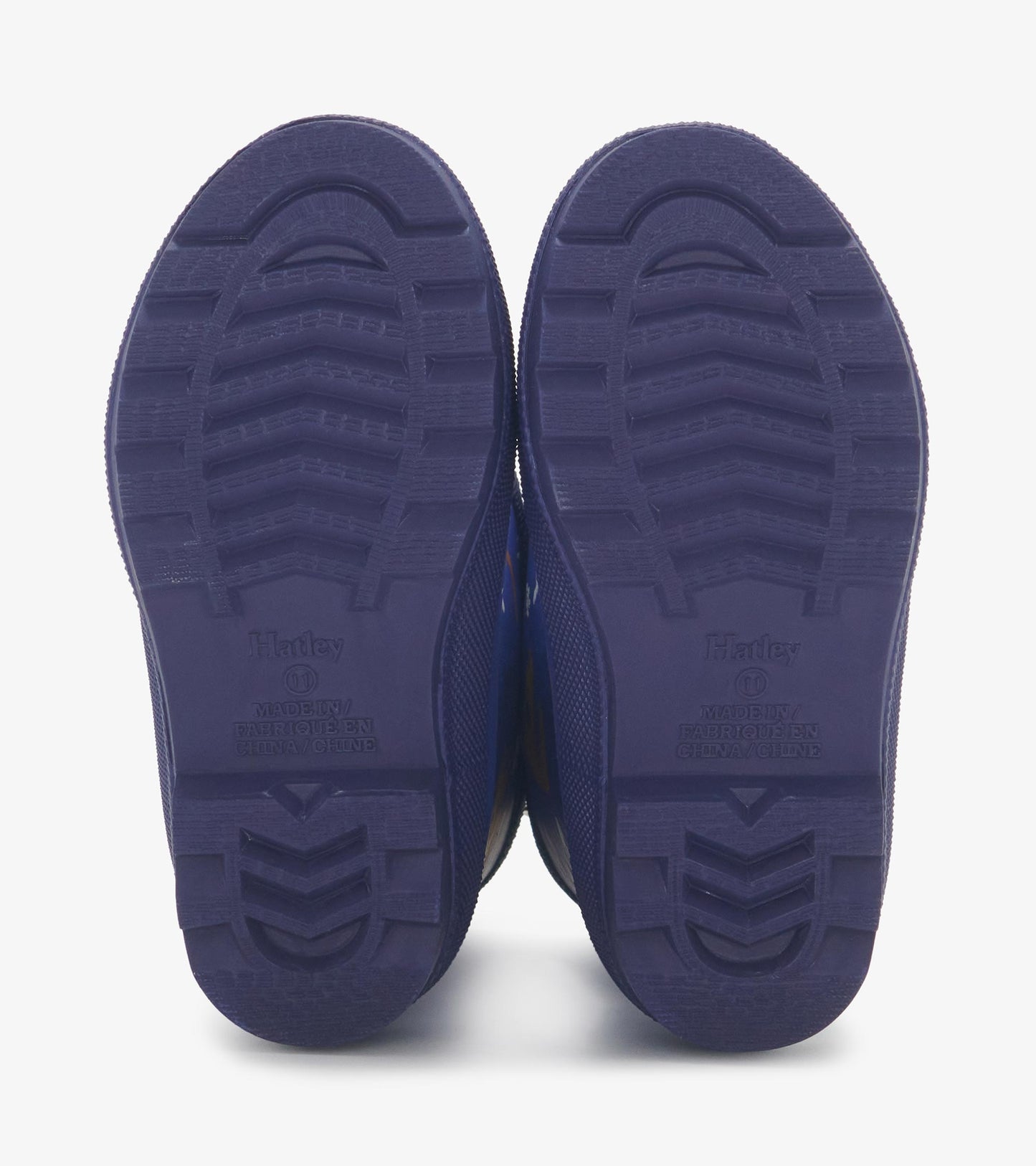 Purple matte wellies with textured soles, featuring a dinosaur fossil pattern for kids.