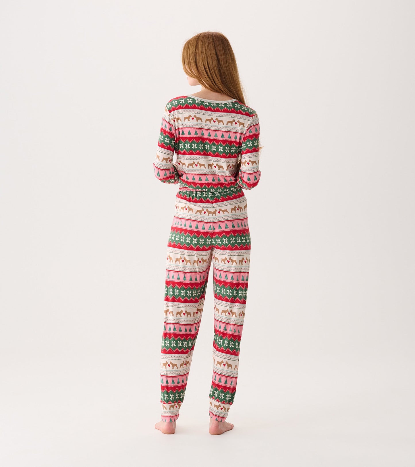 Bamboo pyjama set featuring a festive puppy hearts Fairisle pattern in pink, green, and cream, shown from the back.