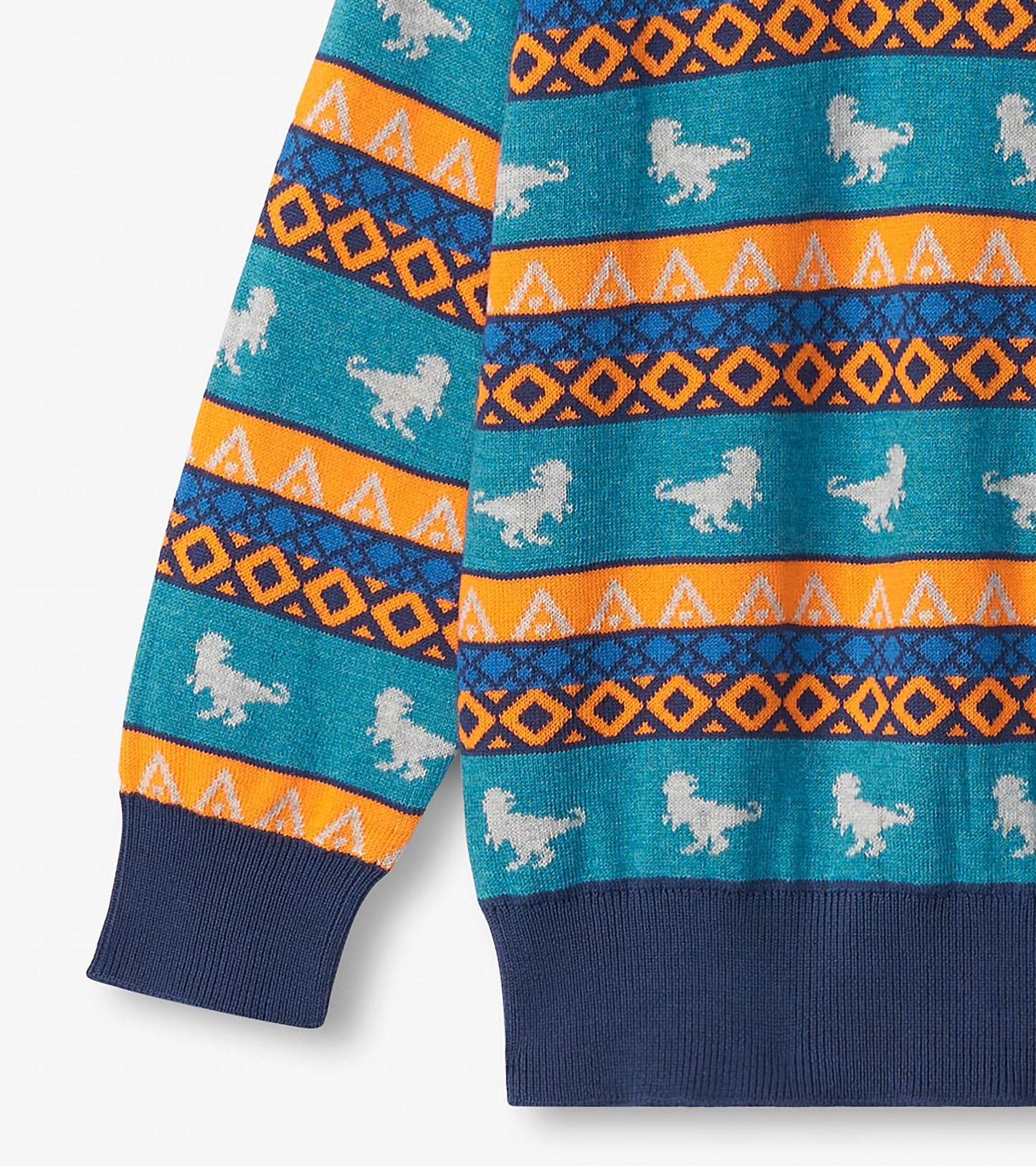 Turquoise sweater featuring dinosaur patterns and geometric designs in orange, blue, and white. Ribbed navy cuffs.