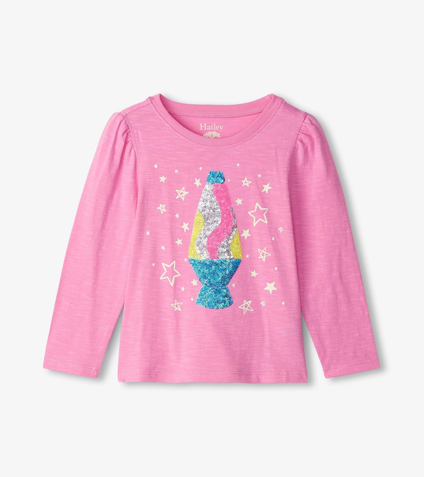 Pink long sleeve tee featuring a glittery lava lamp graphic surrounded by stars.