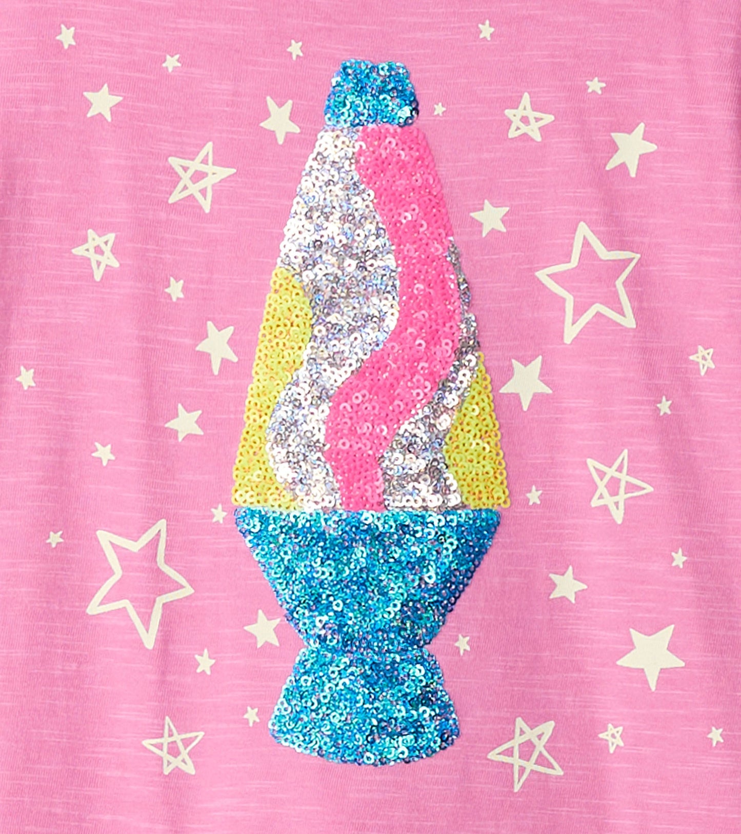 Pink long sleeve tee featuring a colorful, sequined lava lamp graphic surrounded by star motifs.