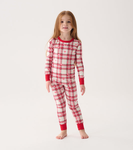 Red and white plaid pyjama set with heart patterns, featuring long sleeves and fitted pants.