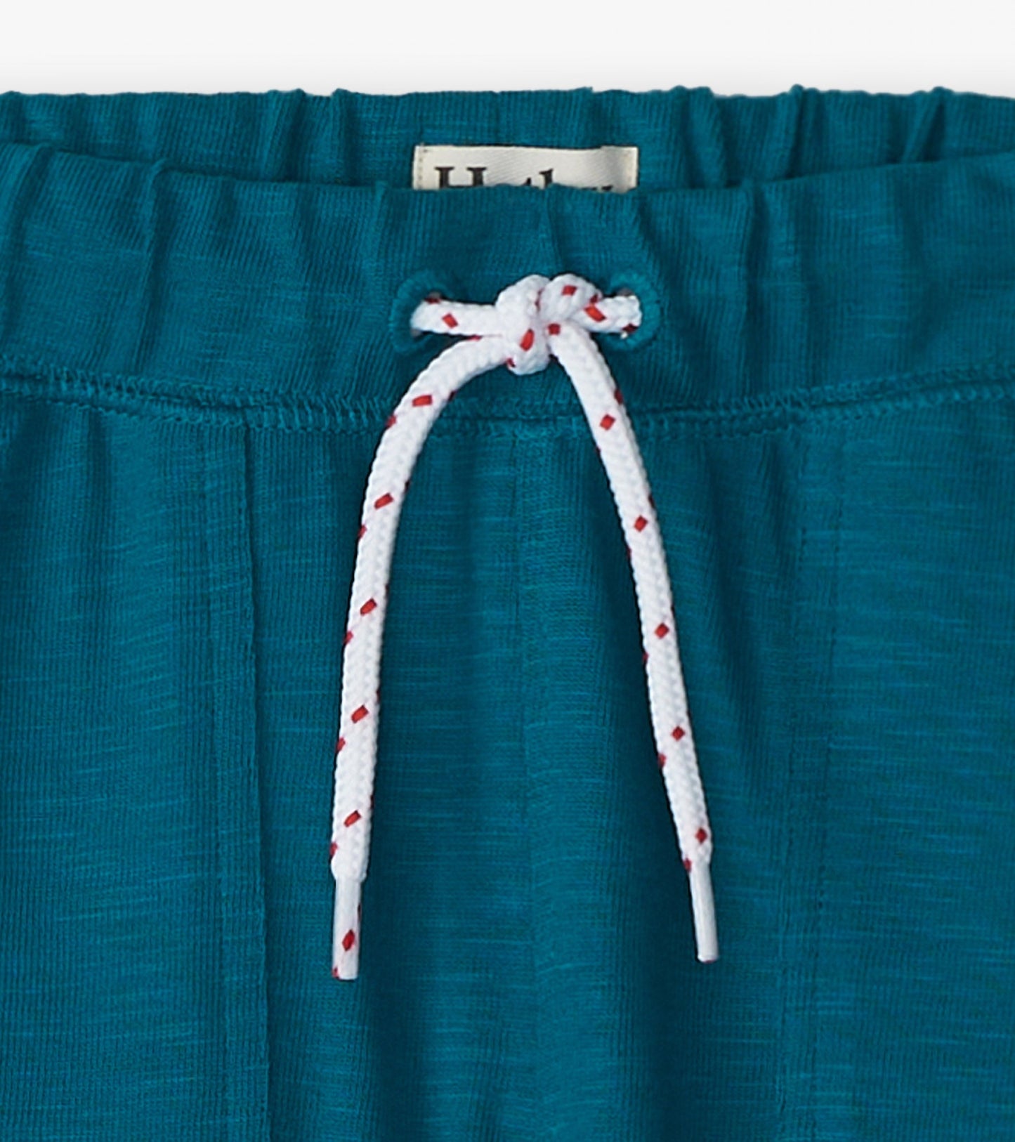 Cozy Moroccan blue pants with an elastic waistband and white drawstring, suitable for boys.