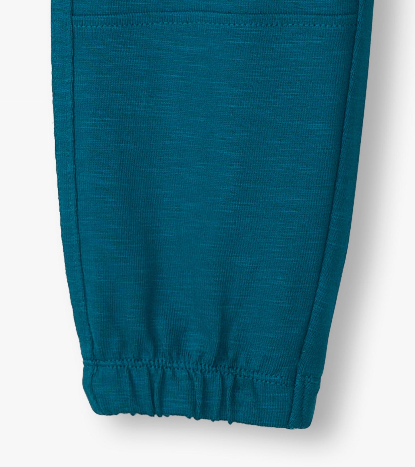 Cozy boys' pants in Moroccan blue, featuring a soft texture and elastic cuffs for a comfortable fit.