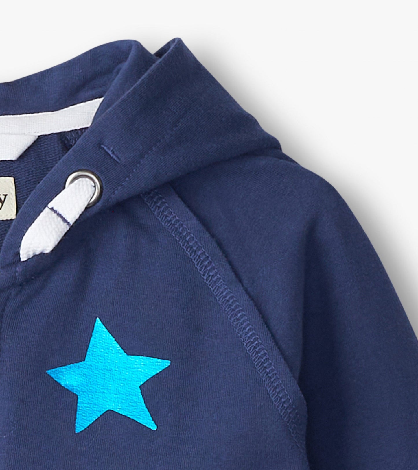 Navy zip-up hoodie for girls featuring a bright blue star design on the front and a drawstring hood.