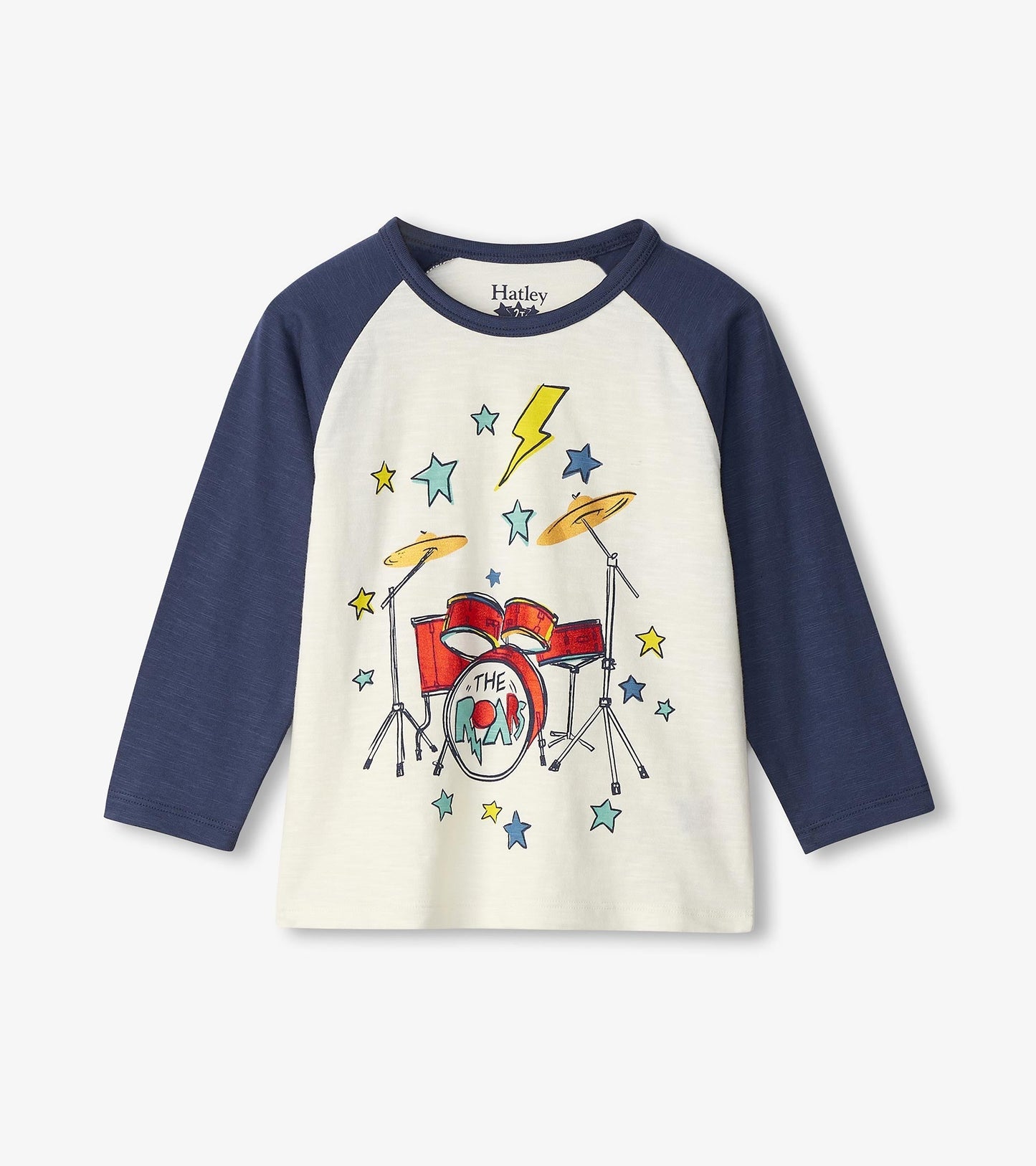 Long sleeve t-shirt featuring a drum kit graphic with colorful stars on a cream body and navy sleeves.