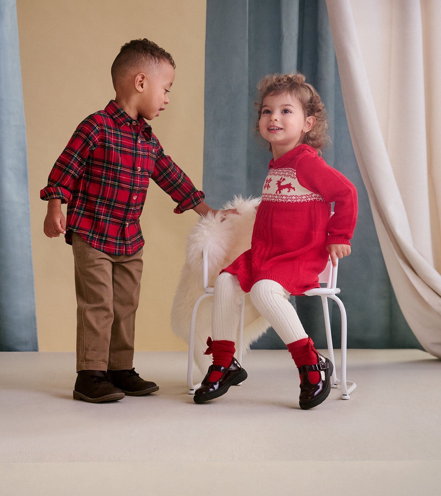 Red plaid button-down shirt for babies and toddlers, featuring a classic collar and button front.
