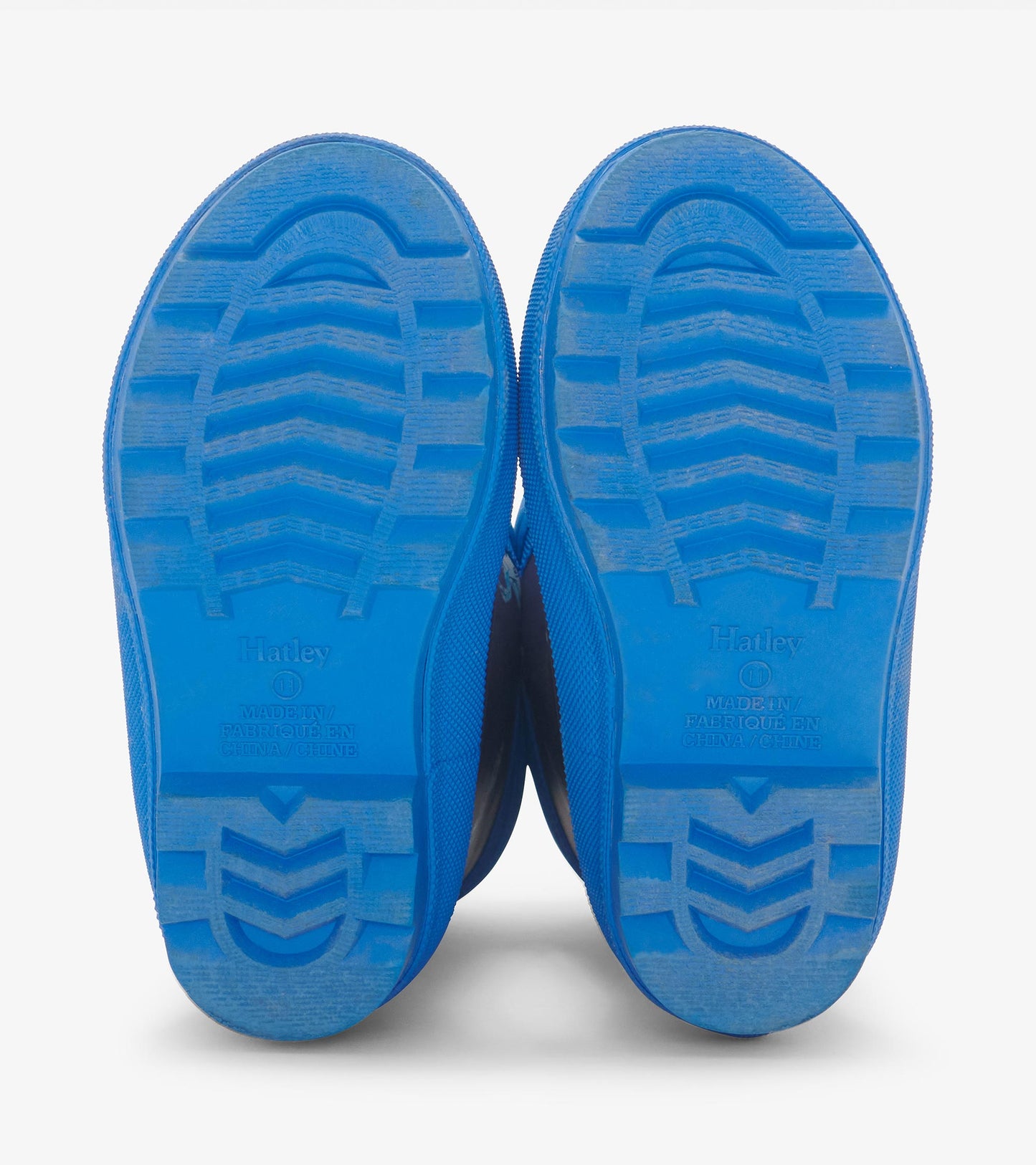 Blue rubber wellies with textured soles, designed for toddlers, featuring a sherpa lining for warmth.