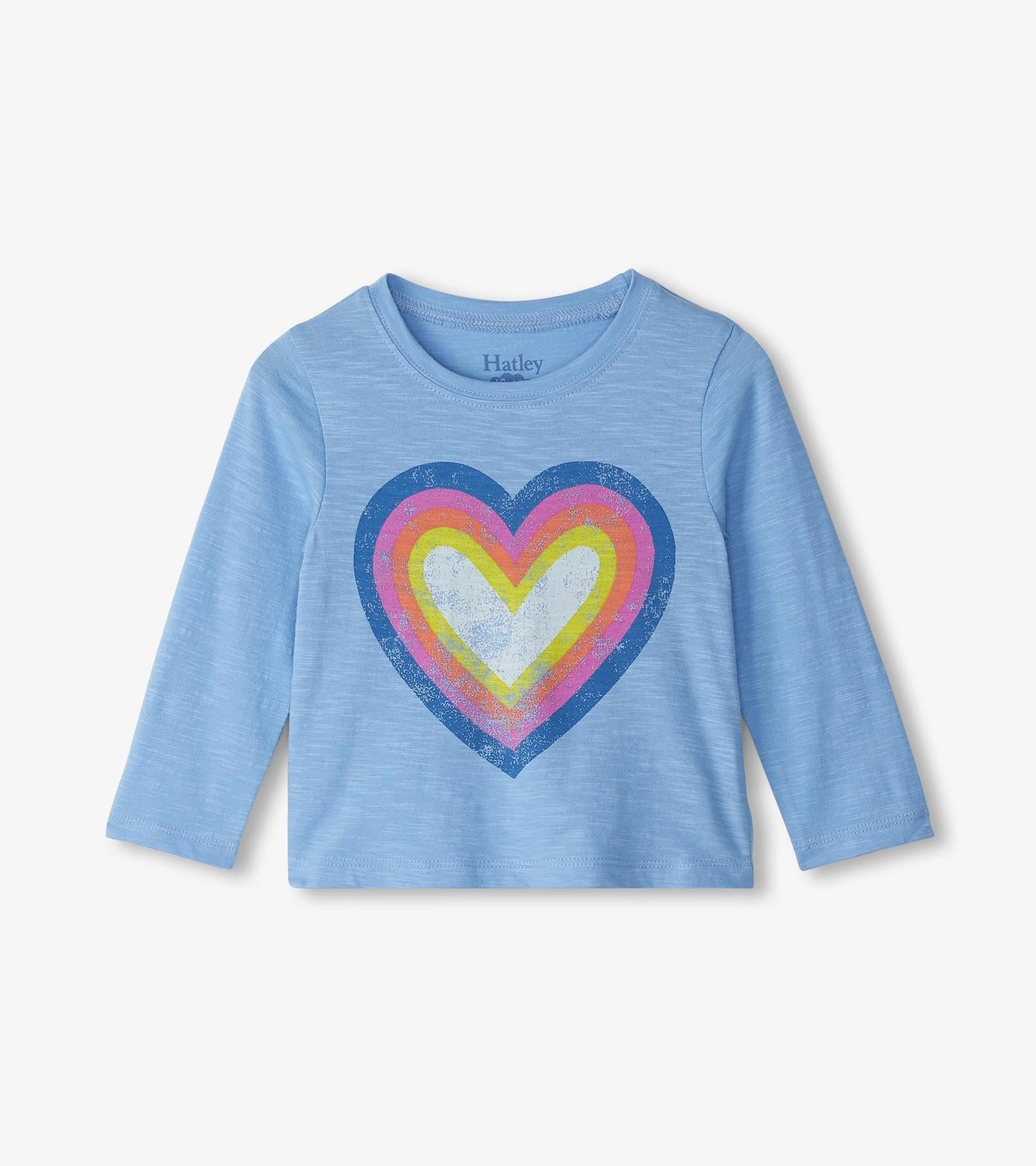Light blue long sleeve t-shirt featuring a large multicolored groovy heart graphic on the front.