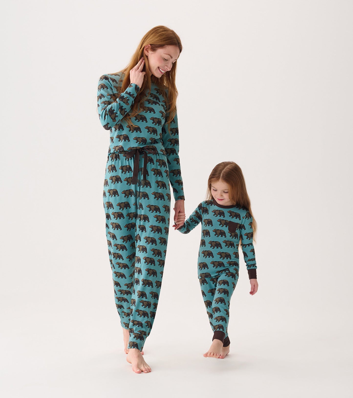 Matching bamboo pyjama set for women and child, featuring a teal color with black bear print, ideal for cozy wear.