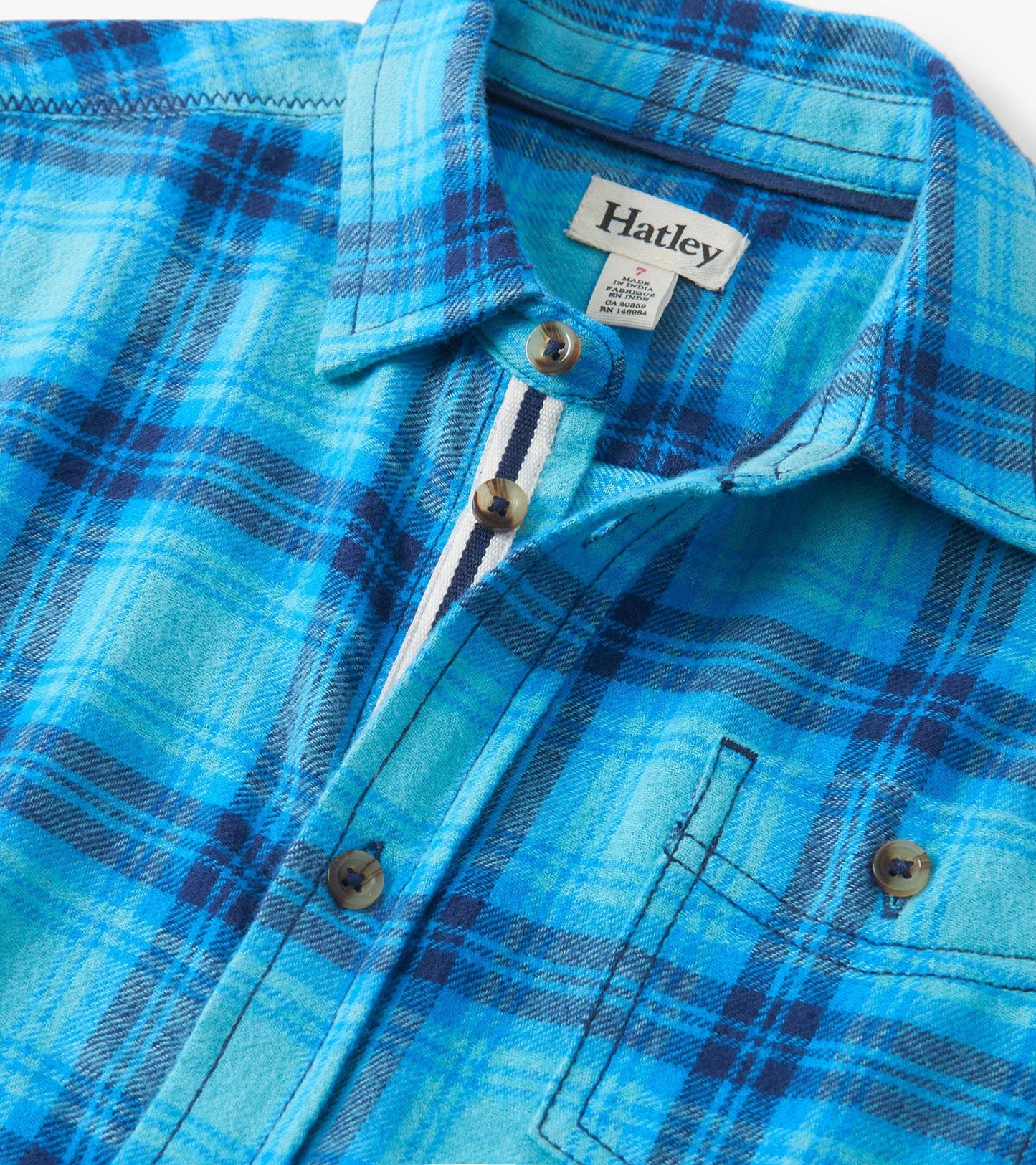 Blue plaid button-down shirt featuring a collar, button front, and chest pocket. Soft fabric suitable for casual wear.