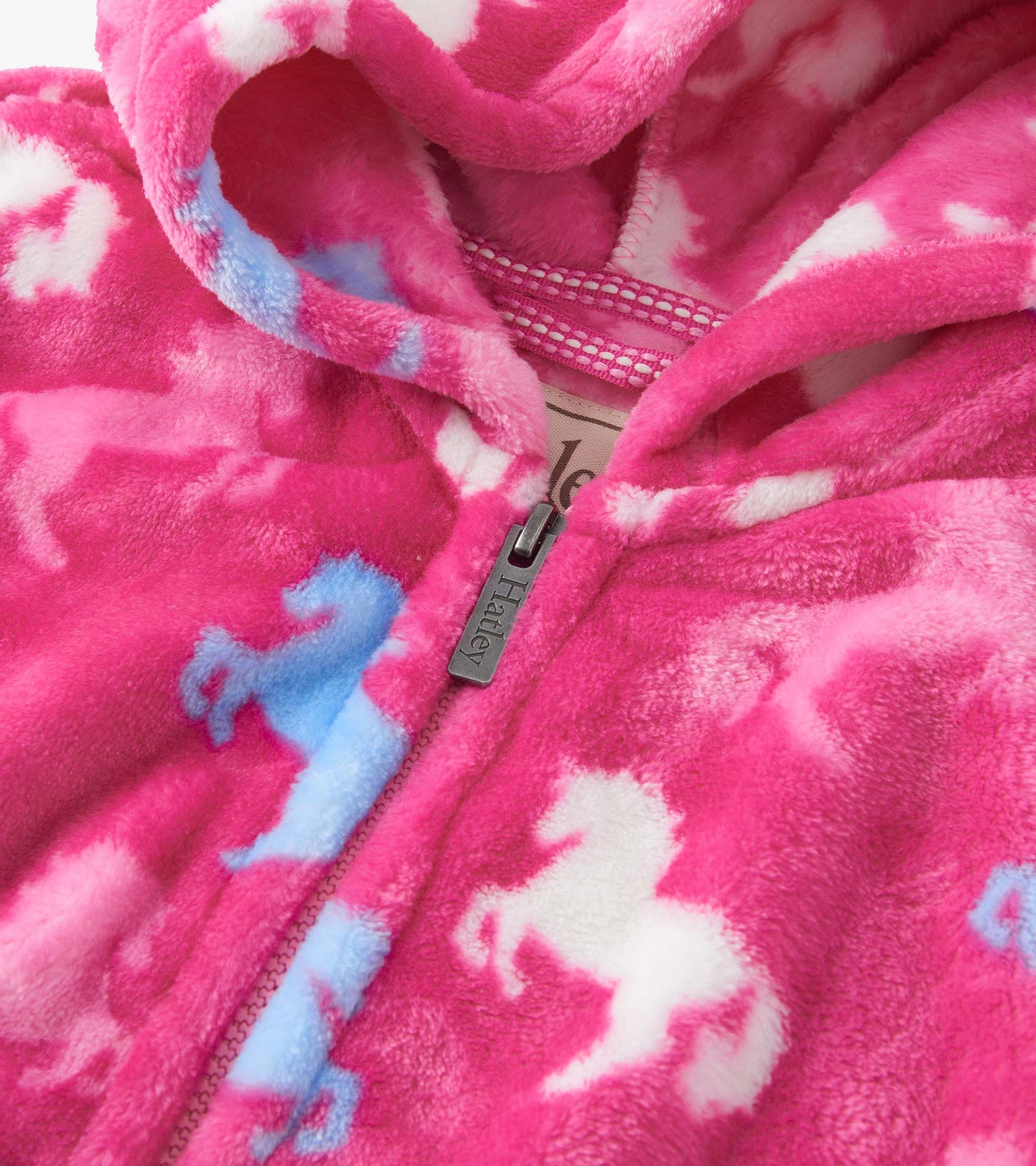 Fleece zip-up hoodie in pink with white and blue horse patterns, featuring a cozy hood and front zipper.