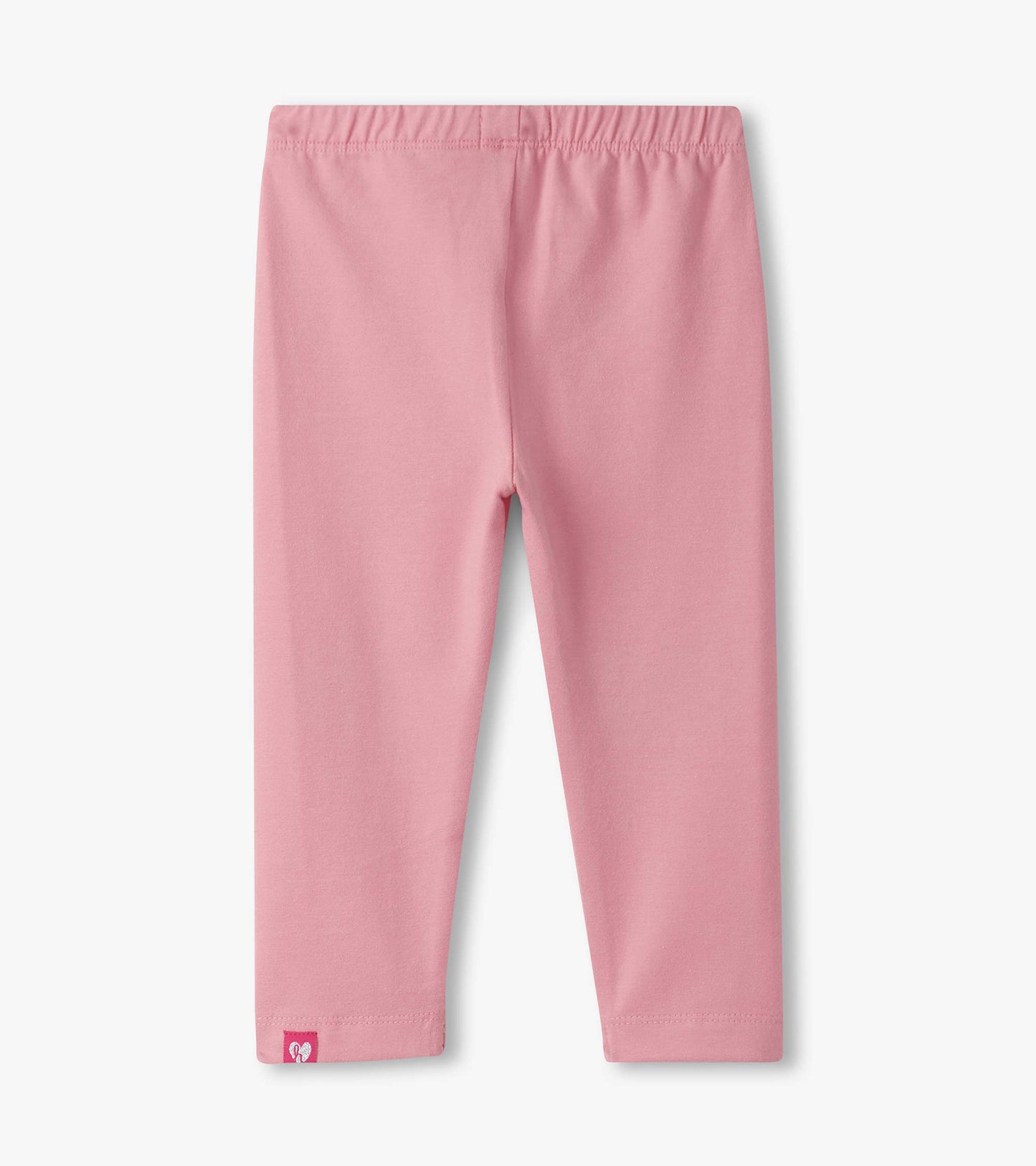 Pink leggings with an elastic waistband, featuring a small logo tag at the hem. Suitable for baby and toddler girls.