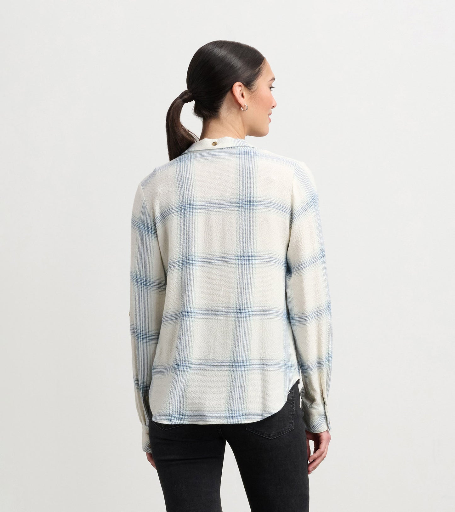 Turquoise plaid button-down shirt with long sleeves and a relaxed fit, viewed from the back.