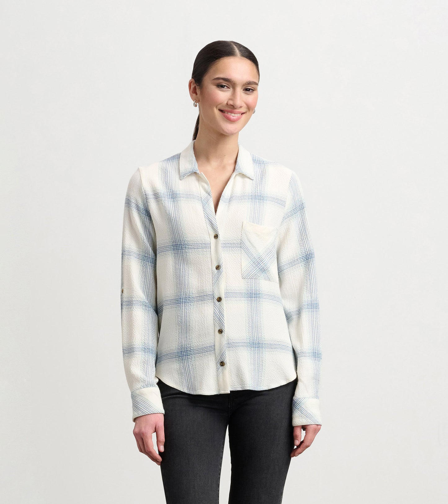 Turquoise plaid button-down shirt with a pocket, featuring a relaxed fit and long sleeves.