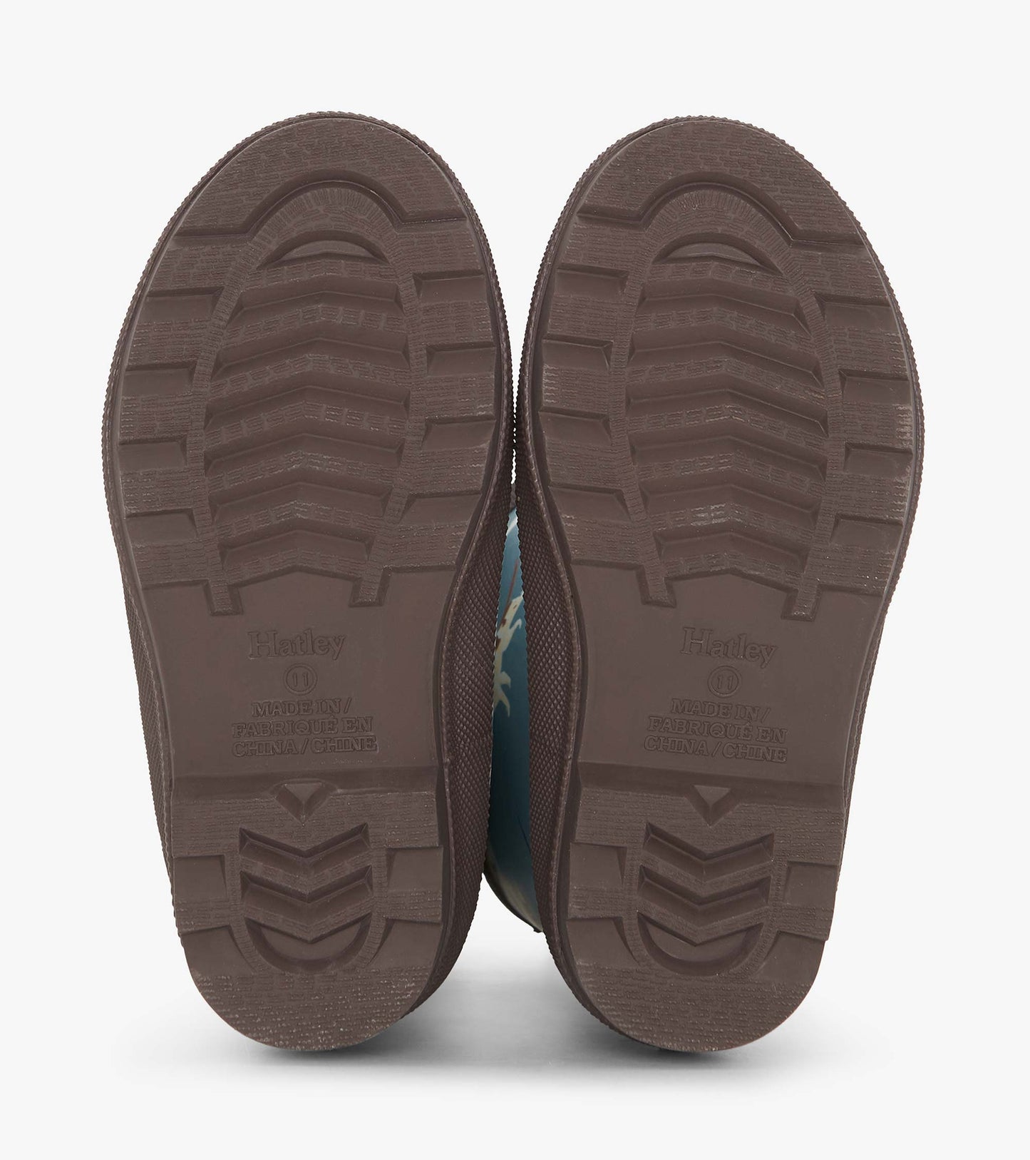 Brown-soled matte wellies with a blue upper featuring hunting dog patterns, designed for boys.