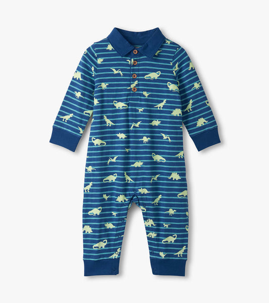 Navy blue polo romper with glow-in-the-dark dinosaur patterns and striped design, featuring long sleeves and button closure.