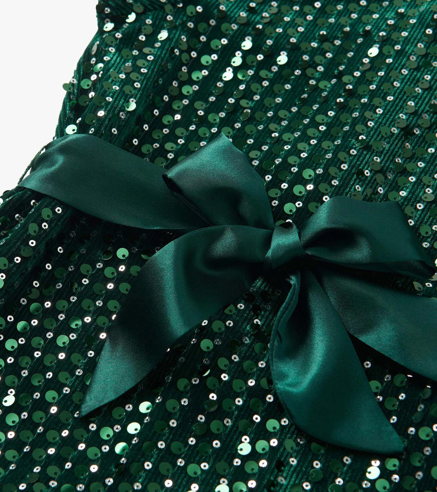 Green velvet dress adorned with sequins and a satin bow detail.