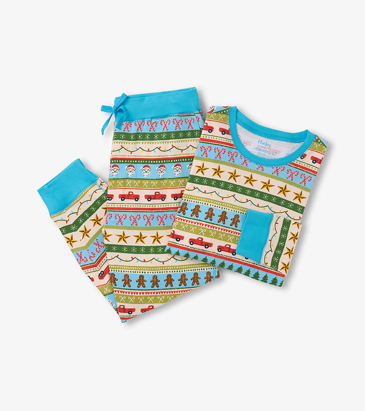 Blue cotton pyjama set featuring a festive Fair Isle pattern with gingerbread men, candy canes, and holiday motifs.