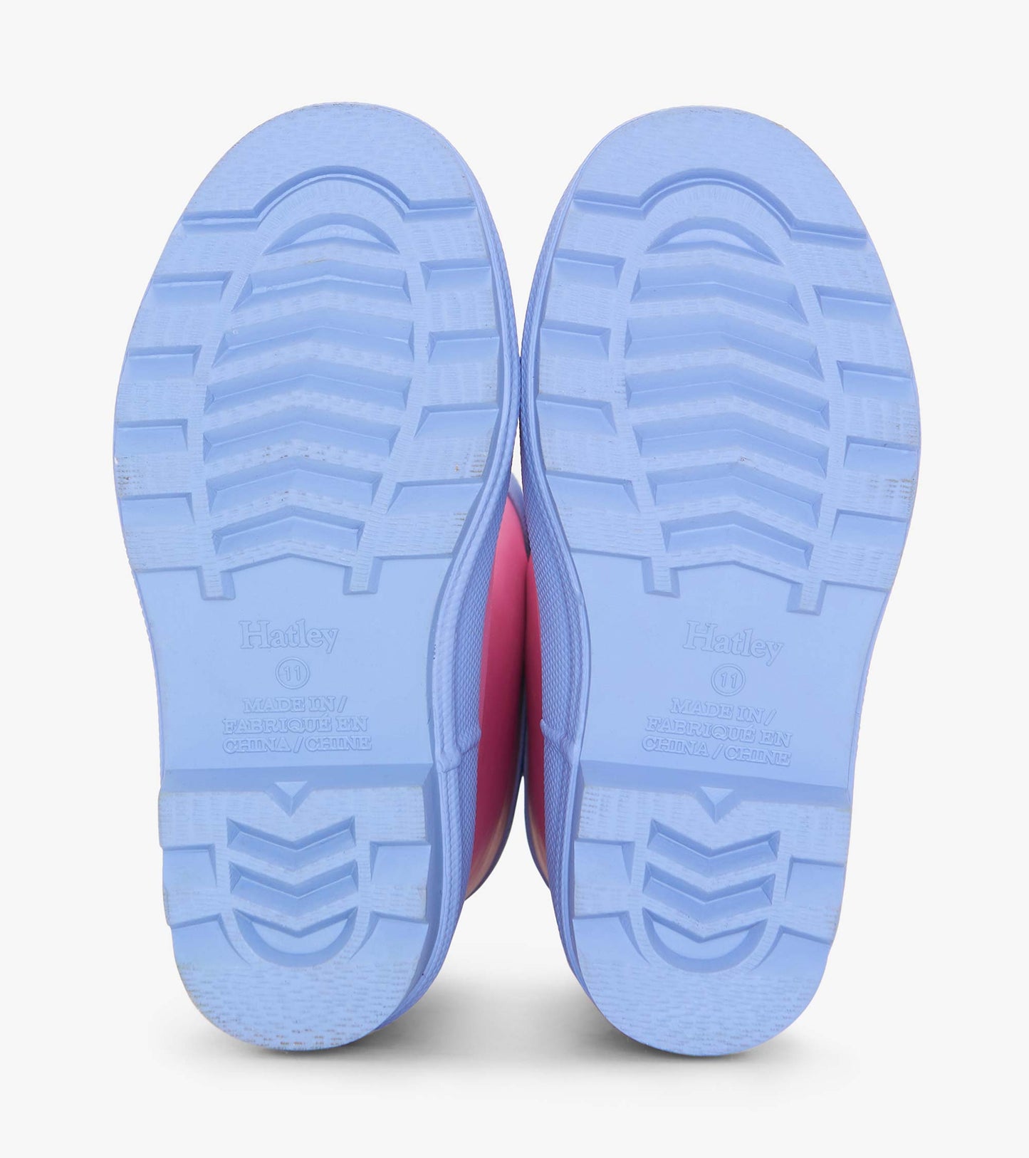 Fuchsia matte wellies with a textured blue sole, designed for kids, ideal for wet weather and outdoor play.
