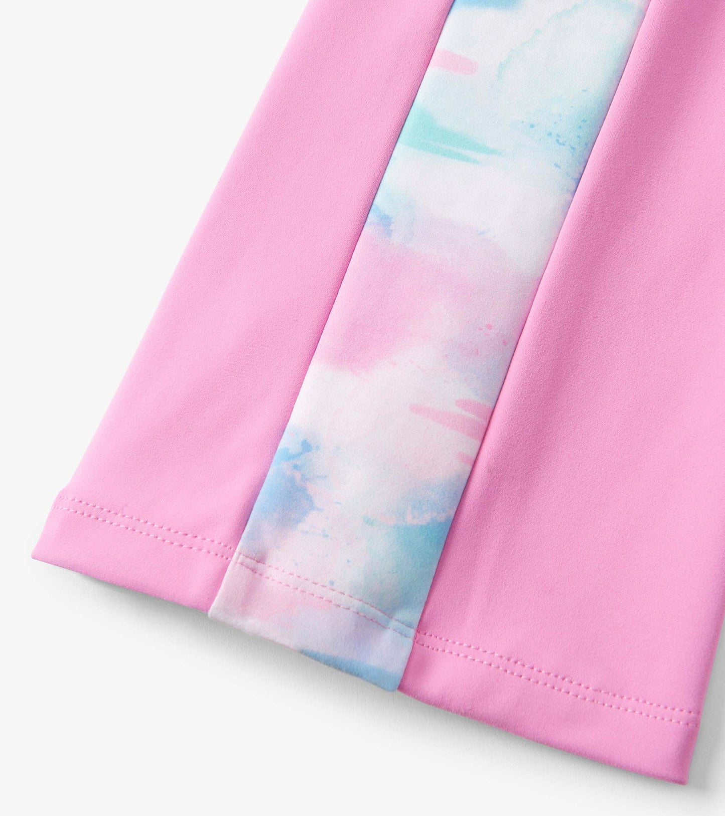 Fuchsia pink active flared pants with a colorful watercolor pattern panel, suitable for active wear.