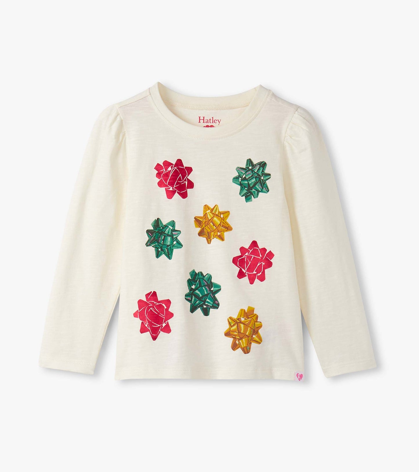 Cream long-sleeve tee featuring colorful bow graphics on the front, with puff sleeves for a festive look.