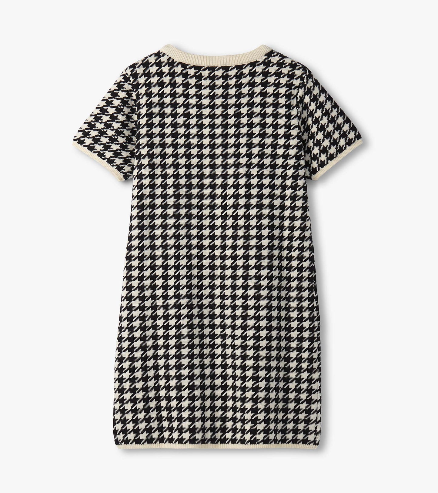 Black and white houndstooth sweater dress with short sleeves and faux fur pockets, featuring a ribbed neckline.