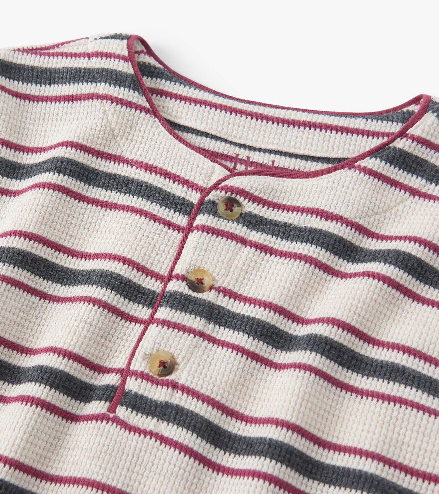Oatmeal melange waffle henley featuring horizontal stripes in burgundy and navy, with three buttons at the neckline.