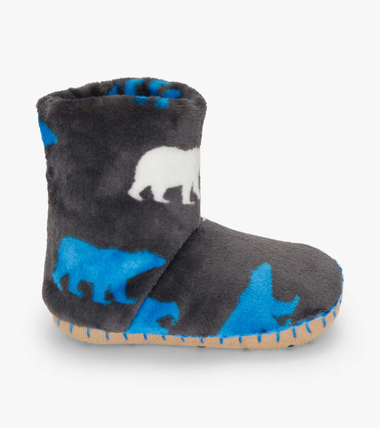 Fuzzy fleece slippers in gray with polar bear silhouettes in blue and white, featuring a soft, cozy design.