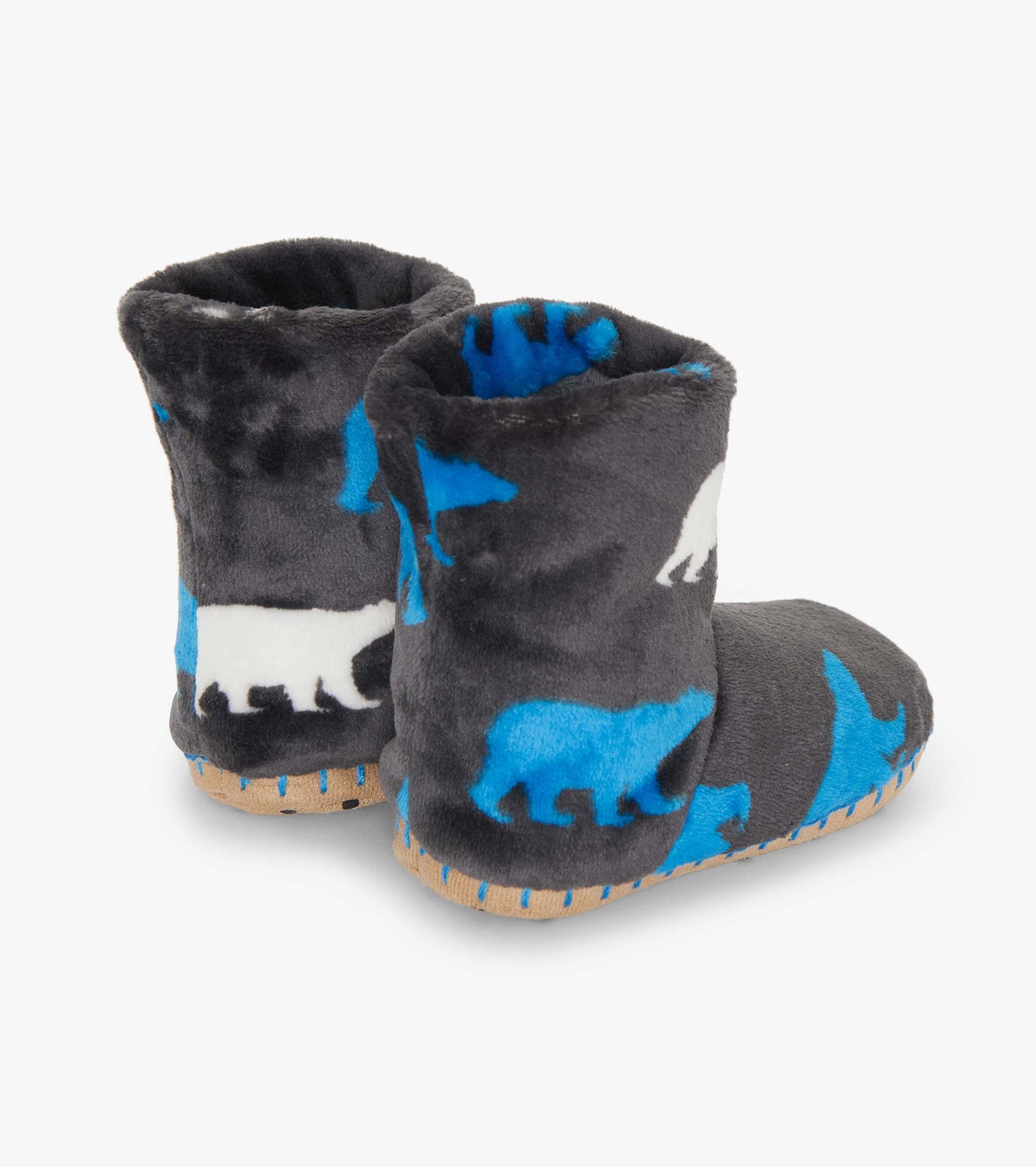 Fuzzy fleece slippers in gray with polar bear silhouettes in blue and white, featuring a soft, cozy design.