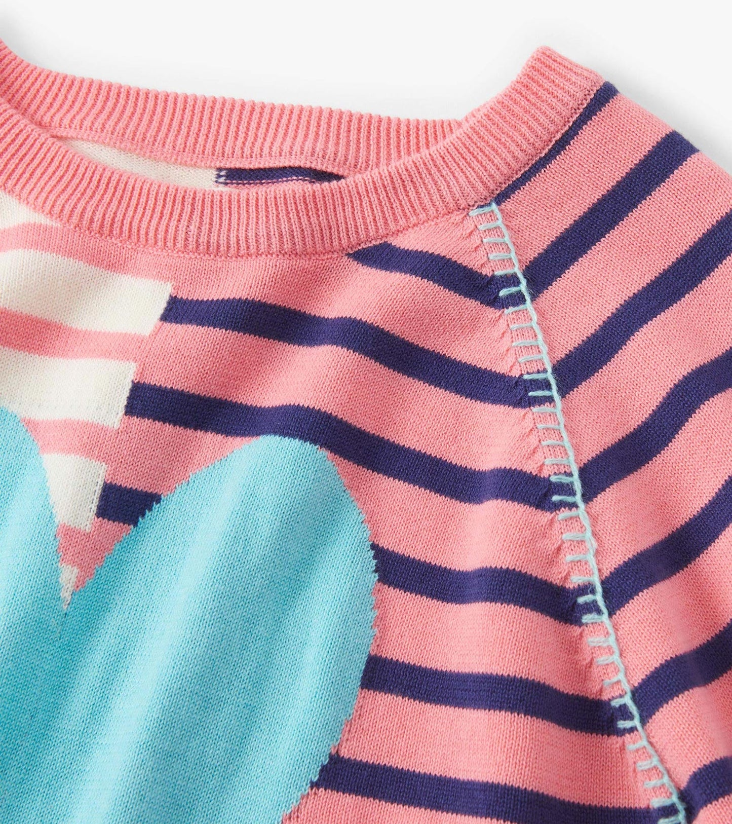 Pink and navy striped sweater featuring a large blue heart design and a ribbed neckline.