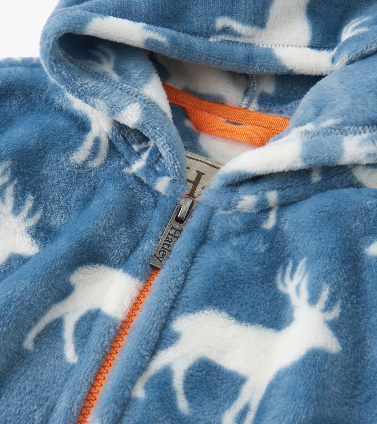 Blue fuzzy fleece zip-up hoodie featuring white elk patterns and an orange zipper.