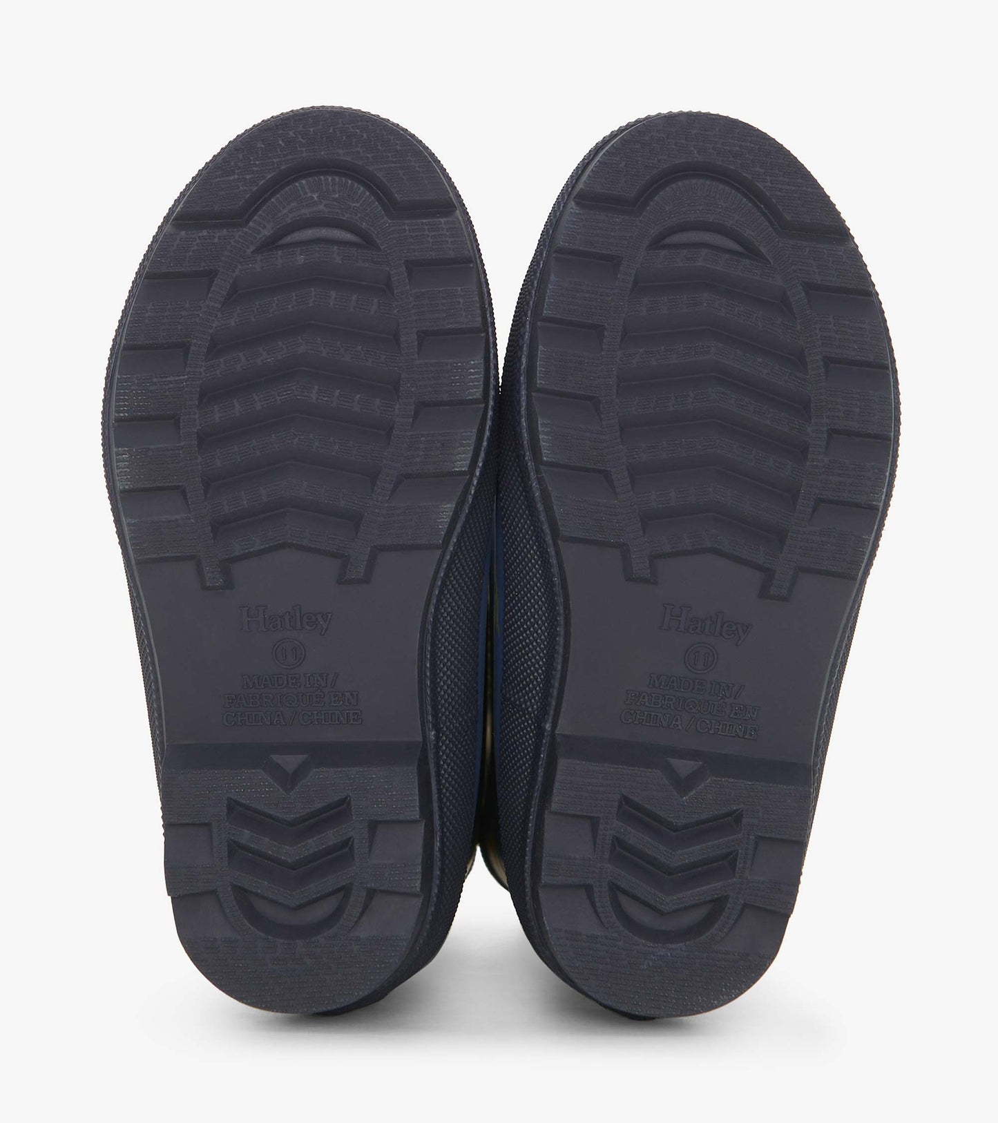 Matte navy wellies with textured soles, designed for boys, featuring a landscape tractor pattern.