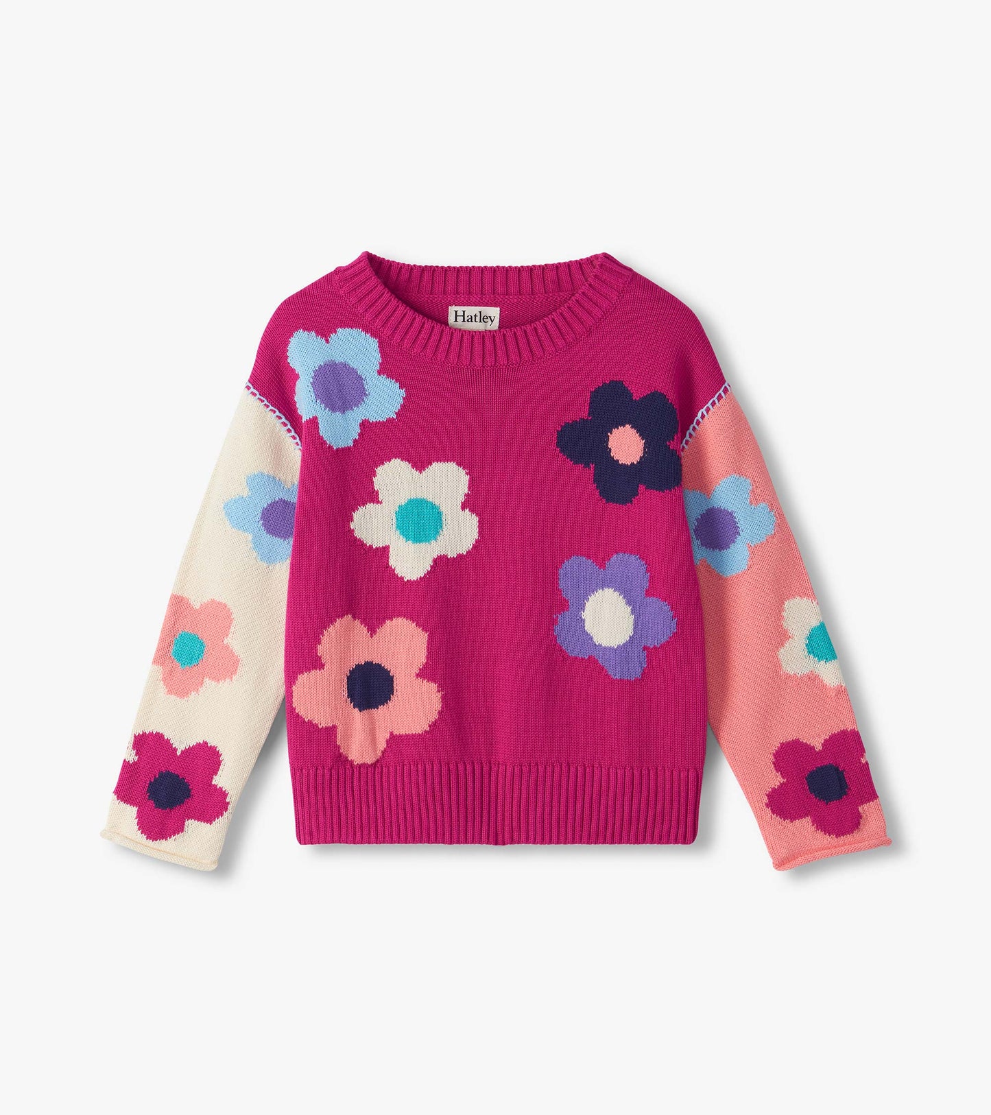 Kids slouchy sweater in bright pink with multicolor flower pattern, crew neck, and pink and cream sleeves