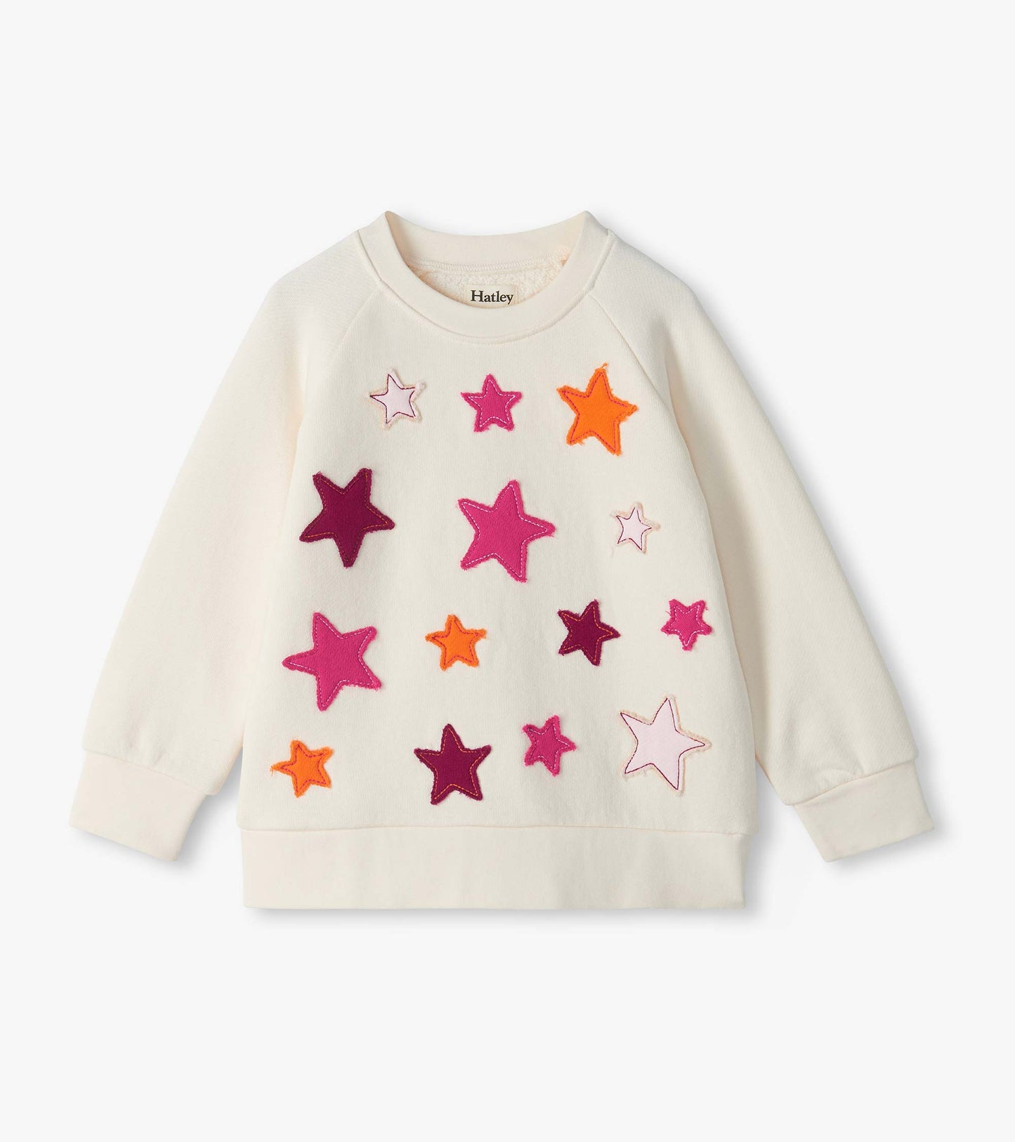 Cream slouchy pullover with colorful star appliqués and long raglan sleeves
