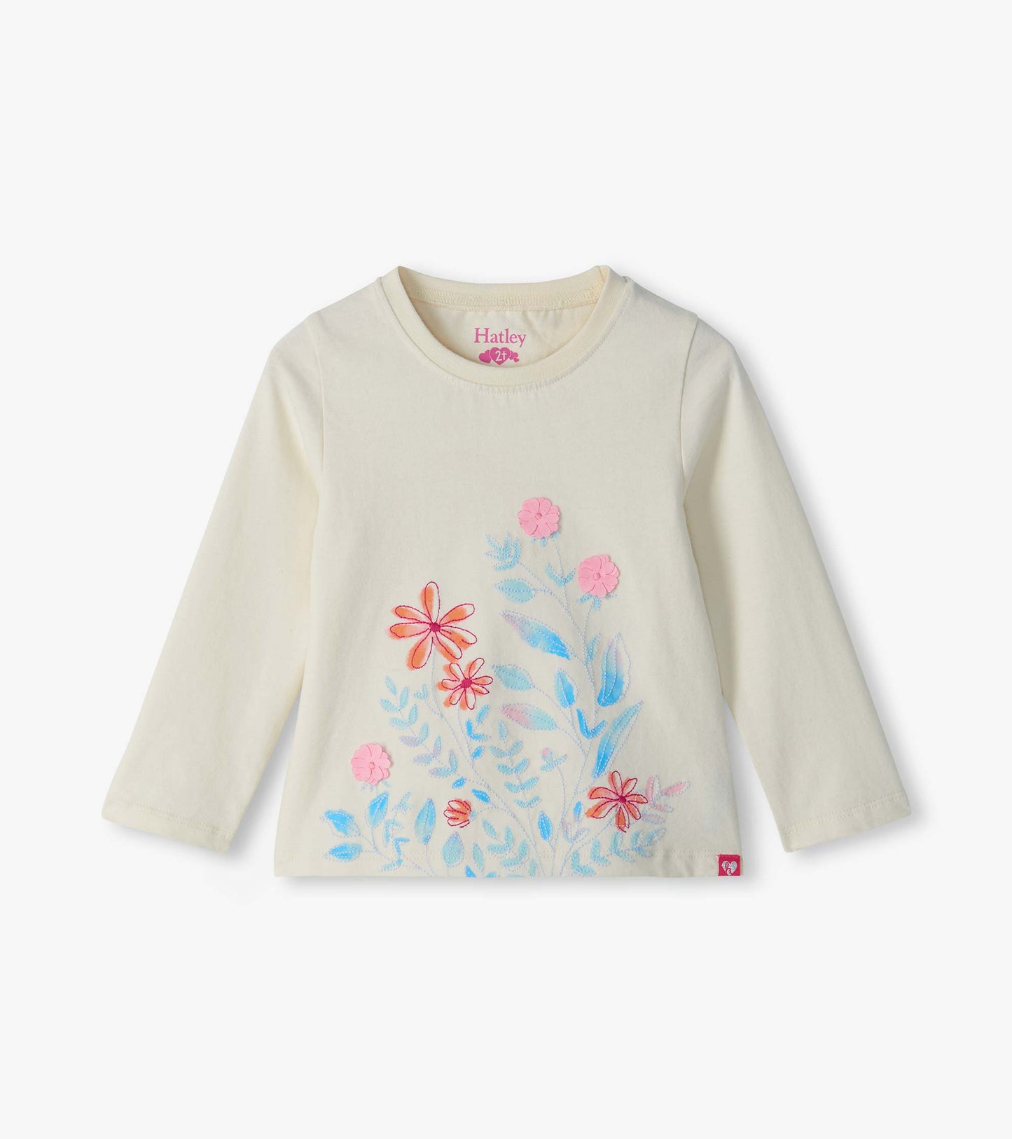 Cream long-sleeve tee with pastel floral print and pink flower appliqués on the front