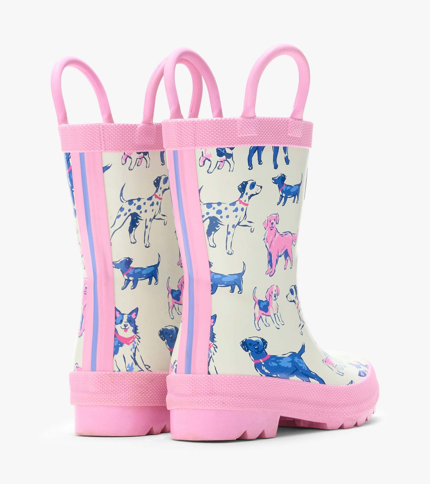 Back angled view of cream rain boots with pink handles, side stripes, and pink and blue dog print