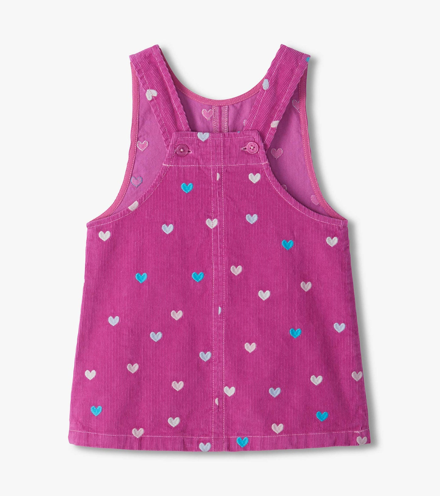 Back of pink pinafore dress with button straps and embroidered heart pattern